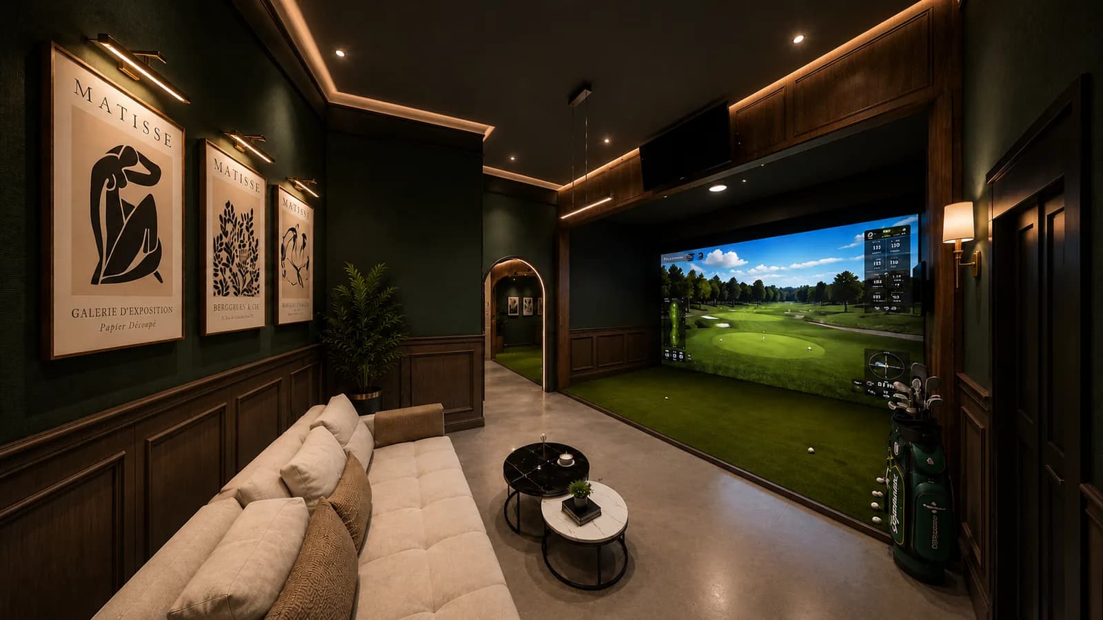 Design visual of a simulator bay with walnut panelling, hitting turf and a golf course on the screen